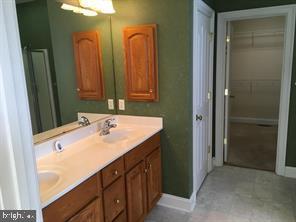 405 Custer Court Berryville, VA 22611 - Photo 27 of 34 a bathroom with a sink and a mirror