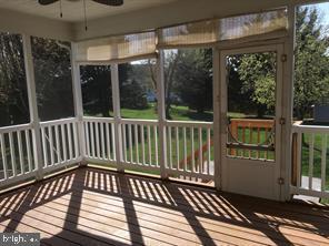 405 Custer Court Berryville, VA 22611 - Photo 5 of 34 a view of a balcony with wooden floor