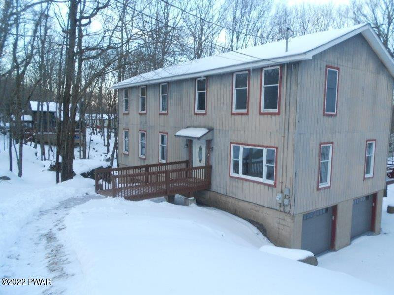 126 Maple Ridge Drive Hawley, PA 18428 - Photo 27 of 40 a view of a house with a yard and wooden fence