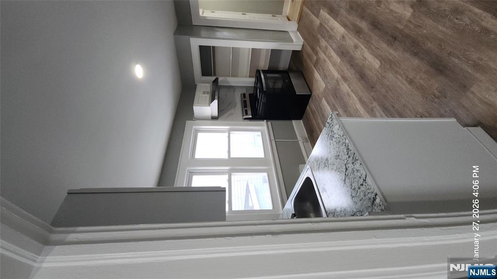180 Vassar Avenue, Unit 178 Newark, NJ 07112 - Photo 2 of 9 a kitchen with sink and window