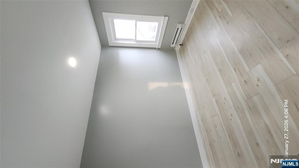 180 Vassar Avenue, Unit 178 Newark, NJ 07112 - Photo 3 of 9 a view of an empty room and window