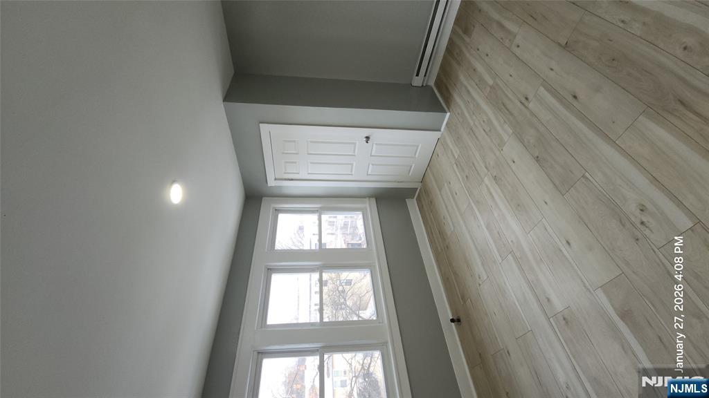 180 Vassar Avenue, Unit 178 Newark, NJ 07112 - Photo 4 of 9 a view of an empty room with a window