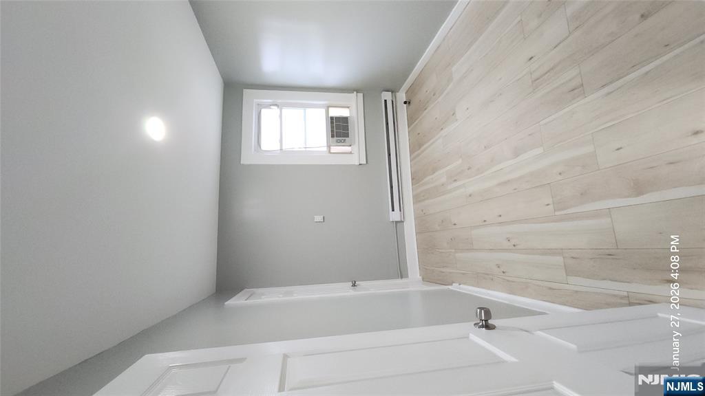180 Vassar Avenue, Unit 178 Newark, NJ 07112 - Photo 6 of 9 wooden floor in an empty room