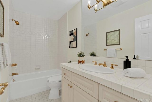 a balcony with table and chairs