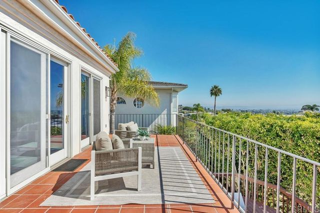 a view of a patio with a table and chairs