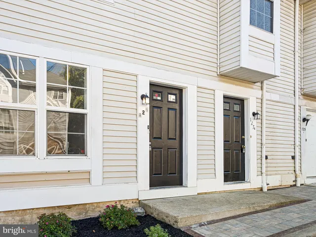 a view of a house with a window and brick walls