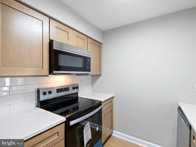 a view of a kitchen with a sink