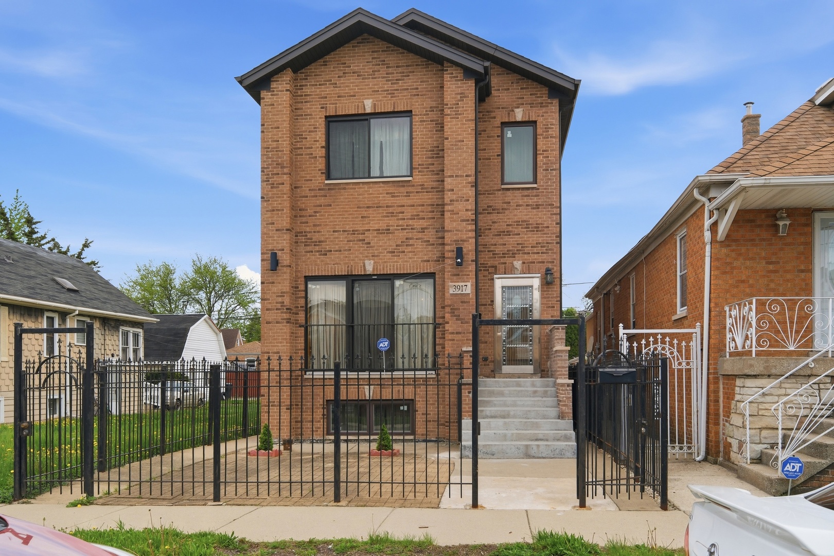 3917 West 60th Street Chicago, IL 60629 - Photo 1 of 34 a front view of a house with iron fence