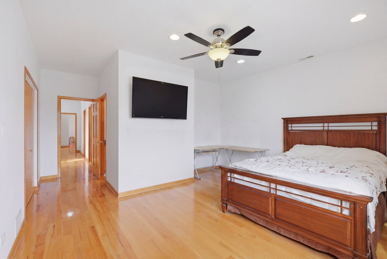 3917 West 60th Street Chicago, IL 60629 - Photo 12 of 34 a bedroom with a bed and a flat screen tv
