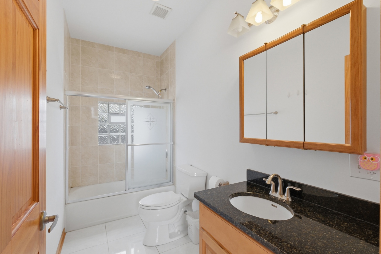 3917 West 60th Street Chicago, IL 60629 - Photo 18 of 34 a bathroom with a granite countertop sink toilet and shower