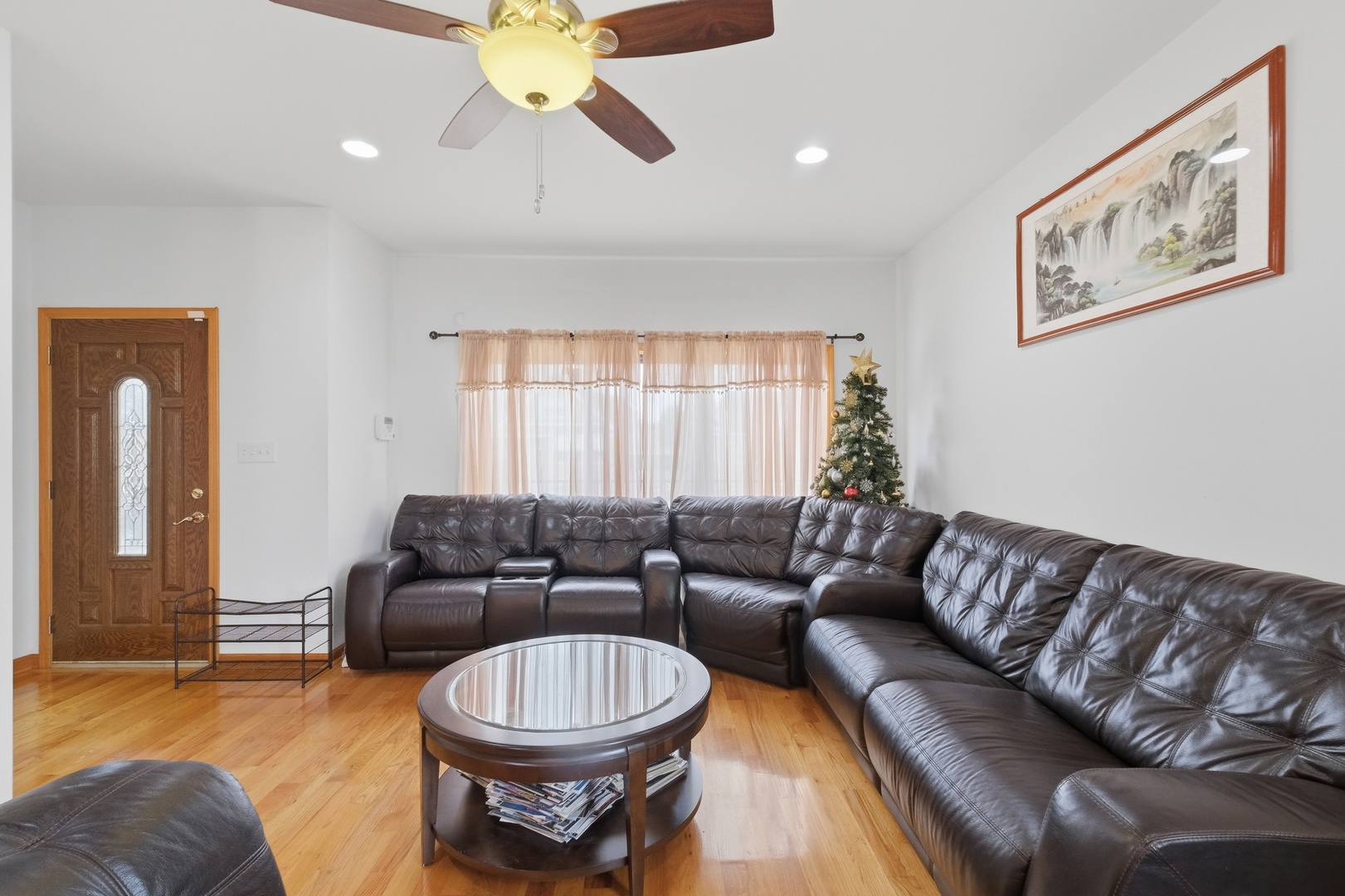 3917 West 60th Street Chicago, IL 60629 - Photo 2 of 34 a living room with furniture and a large window