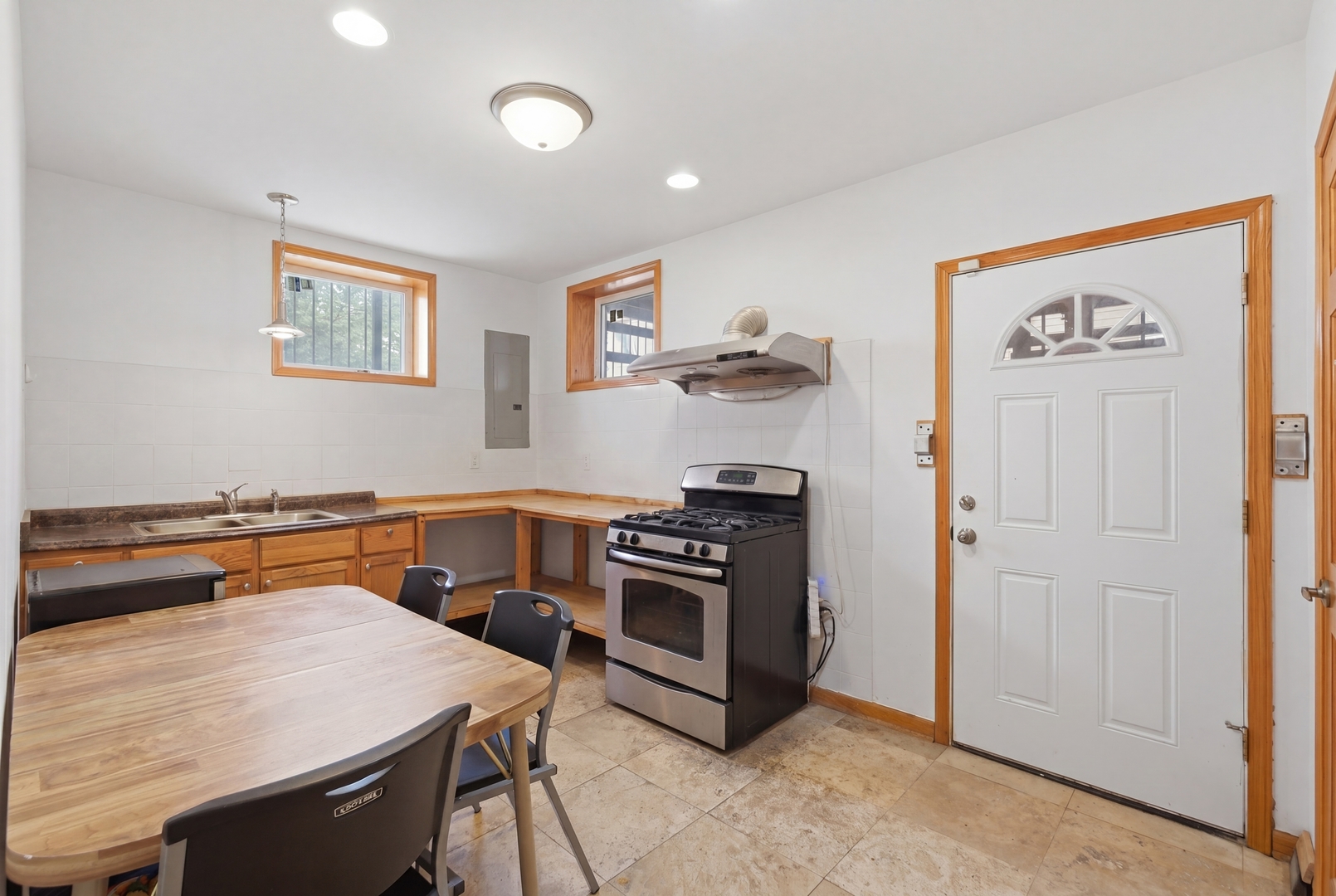 3917 West 60th Street Chicago, IL 60629 - Photo 22 of 34 a kitchen with a stove and a refrigerator