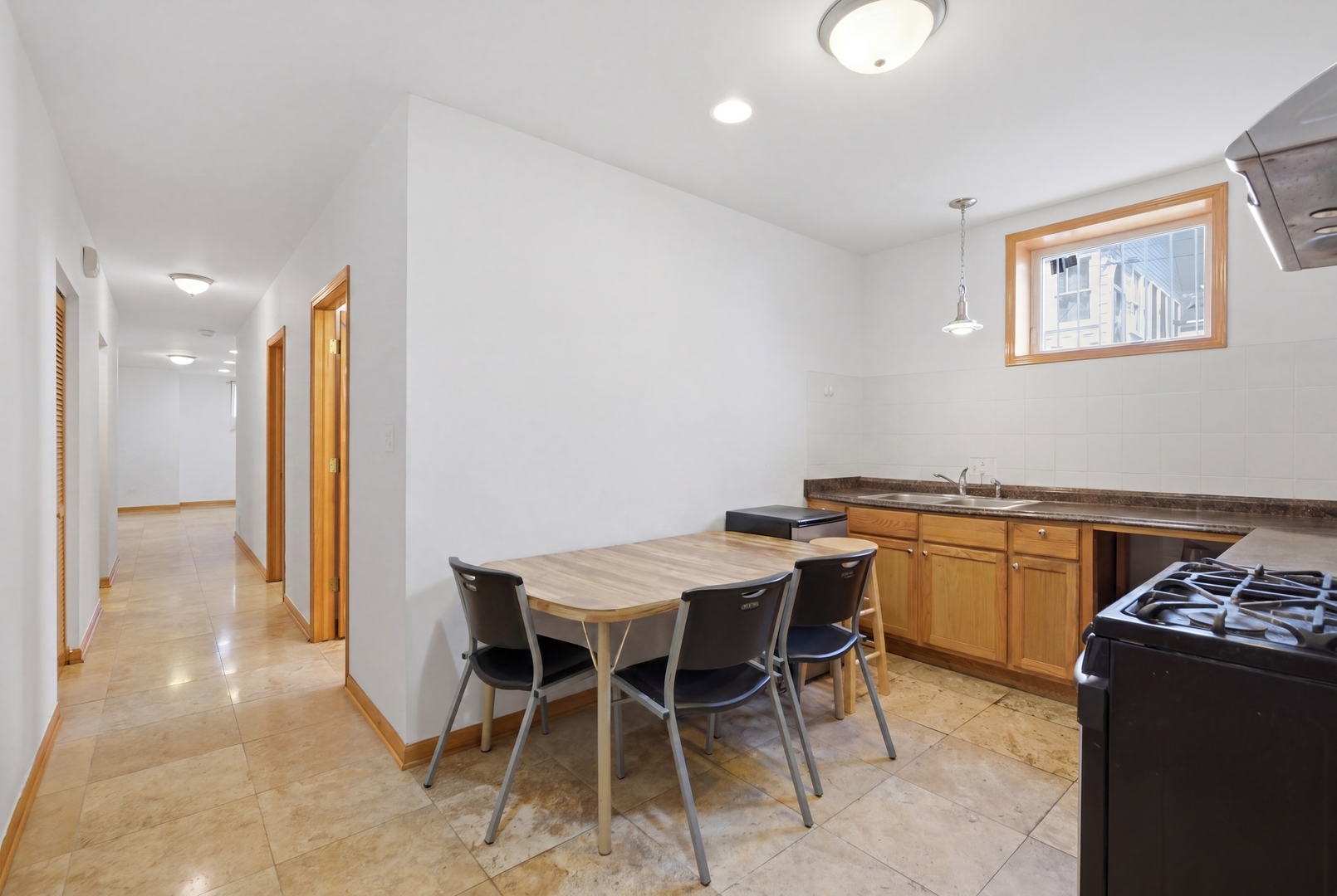 3917 West 60th Street Chicago, IL 60629 - Photo 23 of 34 a kitchen with a table and chairs in it