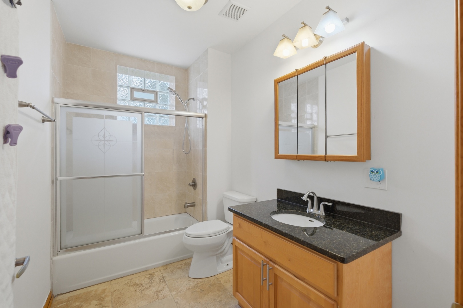 3917 West 60th Street Chicago, IL 60629 - Photo 25 of 34 a bathroom with a granite countertop sink toilet and shower