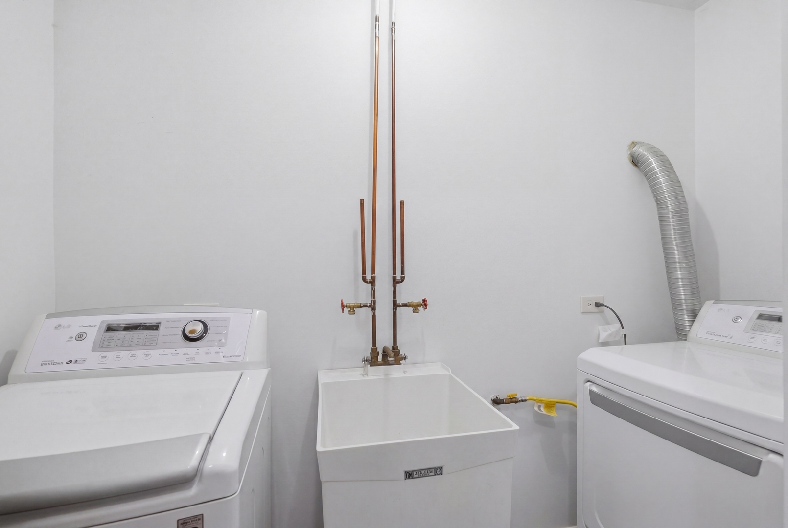 3917 West 60th Street Chicago, IL 60629 - Photo 26 of 34 a bathroom with a sink and a washer dryer