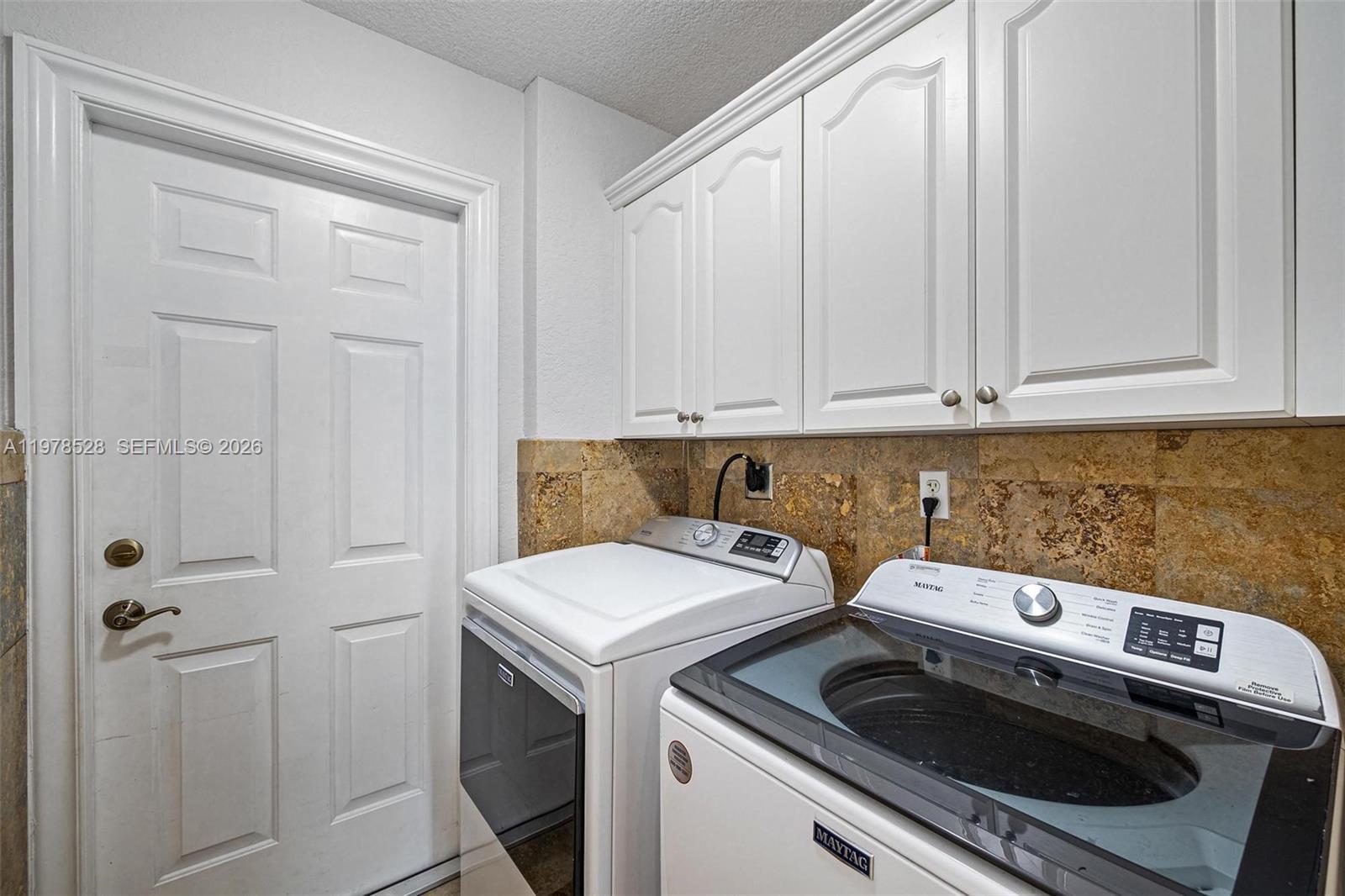 15327 Southwest 55th Terrace Miami, FL 33185 - Photo 30 of 40 a view of a storage and utility room with washer and dryer