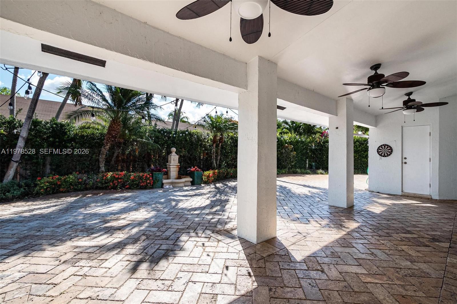 15327 Southwest 55th Terrace Miami, FL 33185 - Photo 35 of 40 a view of a patio with a table and chairs