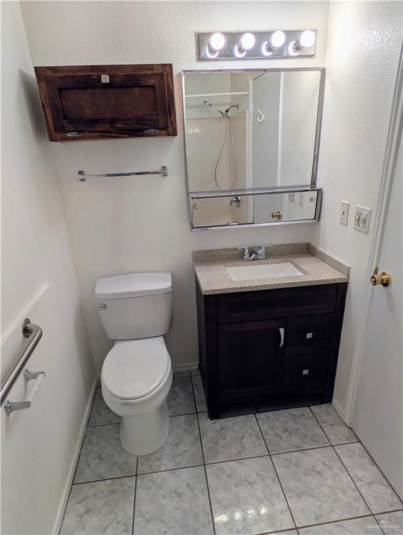 807 East 21st Street, Unit 2 Mission, TX 78572 - Photo 11 of 16 Bathroom featuring vanity and a shower