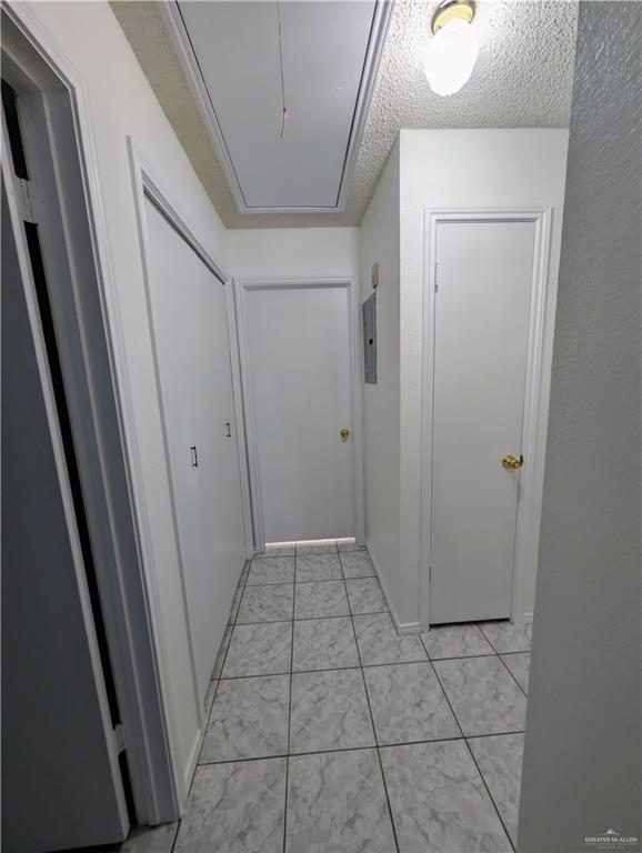 807 East 21st Street, Unit 2 Mission, TX 78572 - Photo 12 of 16 Hall with attic access and a textured ceiling