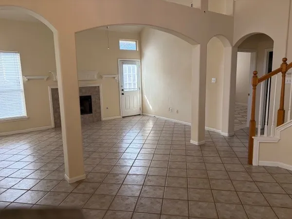 a view of empty room with windows