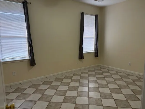 a view of an empty room and window
