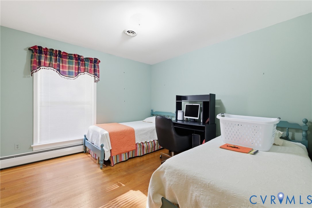 4500 Vauxhall Road Richmond, VA 23234 - Photo 16 of 30 Bedroom featuring a baseboard radiator and wood fi