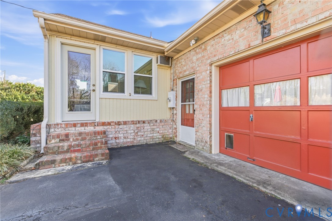 4500 Vauxhall Road Richmond, VA 23234 - Photo 27 of 30 Property entrance with brick siding and a garage