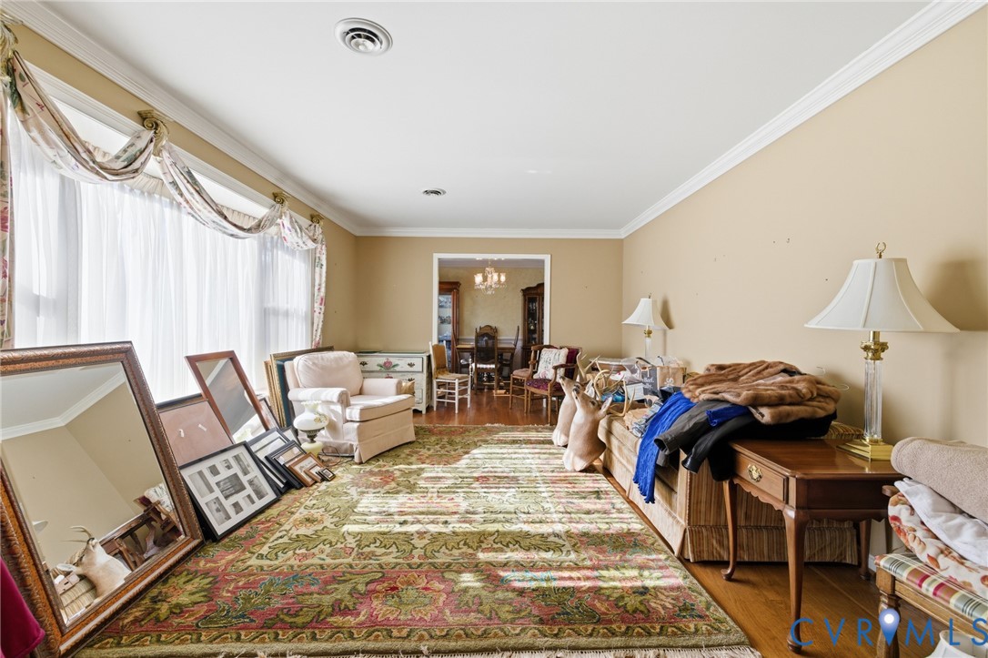 4500 Vauxhall Road Richmond, VA 23234 - Photo 5 of 30 Living room with ornamental molding, a chandelier,