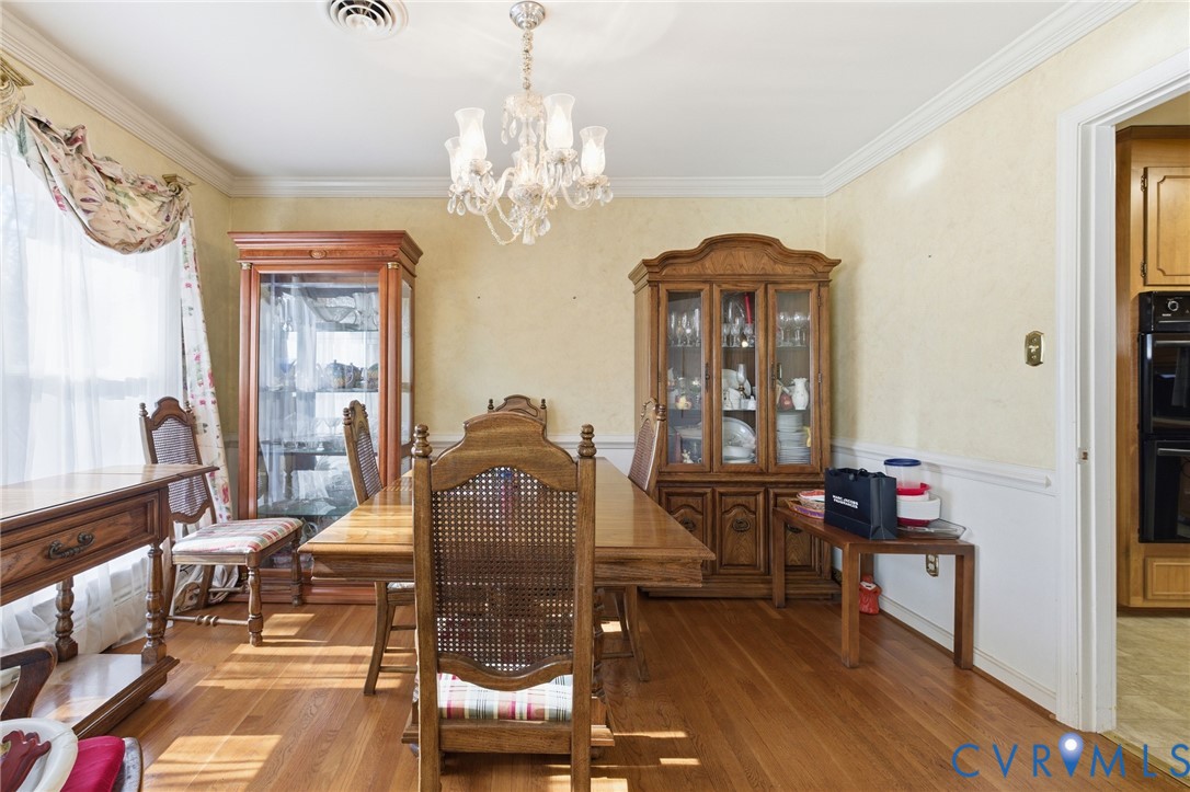 4500 Vauxhall Road Richmond, VA 23234 - Photo 7 of 30 Dining room featuring a chandelier, crown molding,