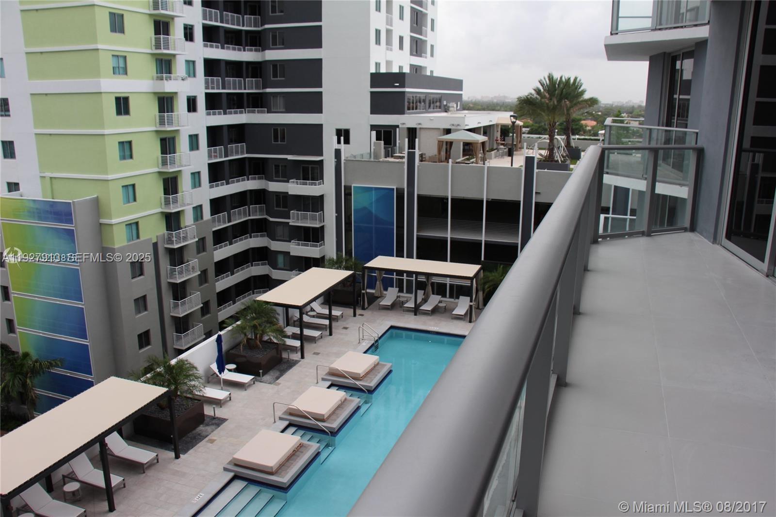1010 Southwest 2nd Avenue, Unit 810 Miami, FL 33130 - Photo 12 of 23 a view of a balcony with chairs and a potted plant