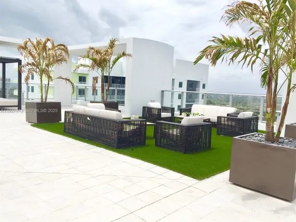 a view of a backyard with swimming pool