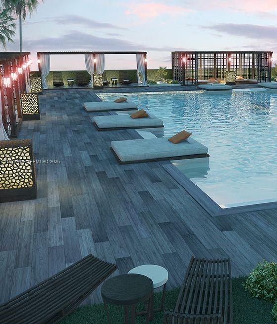 1010 Southwest 2nd Avenue, Unit 810 Miami, FL 33130 - Photo 20 of 23 a view of swimming pool outdoor seating and city view