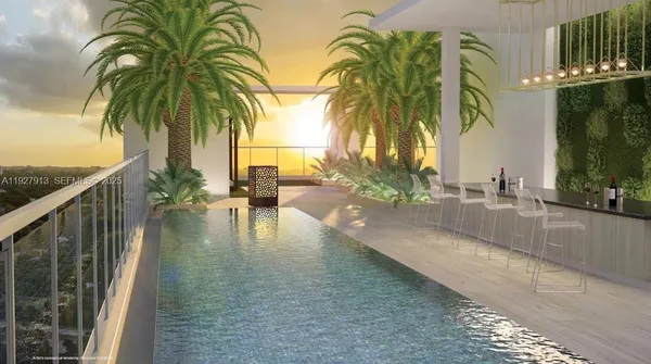 a view of swimming pool with a table and chairs