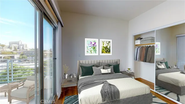 a bedroom with a bed and a large window