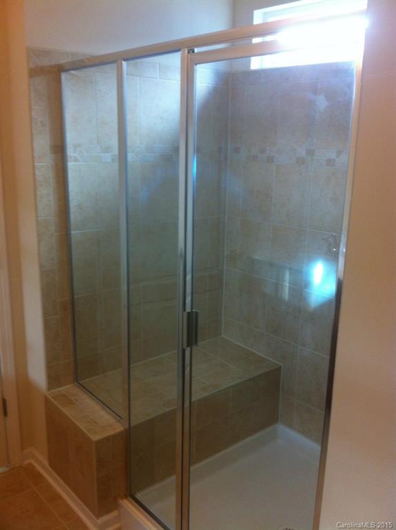 4286 Perth Road, Unit 316 Indian Land, SC 29707 - Photo 8 of 10 a bathroom with a glass shower door