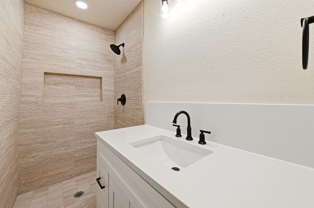 150 Oak Ridge Dr Center Point Center Point, TX 78010 - Photo 8 of 13 a bathroom with a sink and mirror