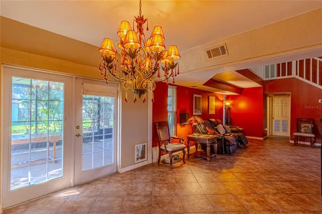 a view of a chairs and tables in patio of the house