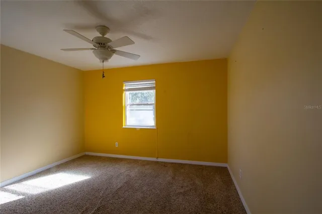 a view of room with furniture and a window