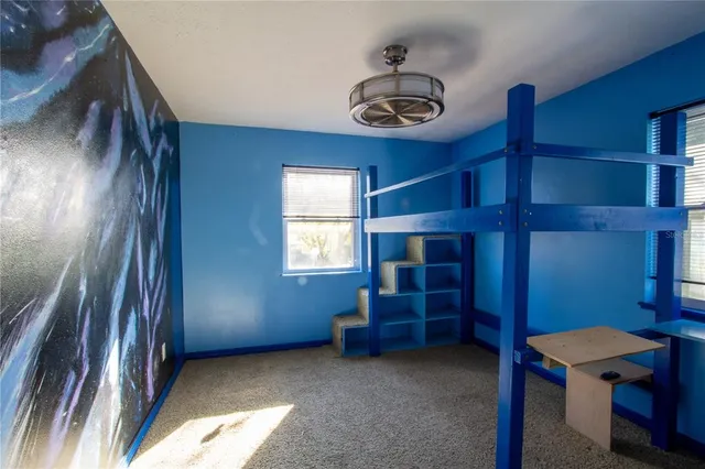 a view of a porch with wooden floor and fence