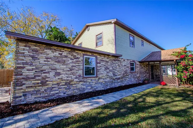 a hallway with beautiful flowers in front of house