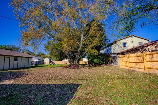 a view of a house with a snow in the yard