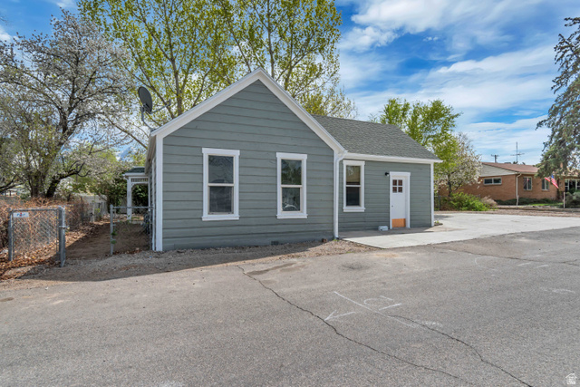 8831 South 400 East Sandy, UT 84070 - Photo 1 of 26 View of front facade featuring a shingled roof