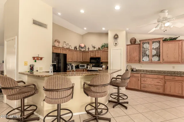 a kitchen with sink cabinets and dining table