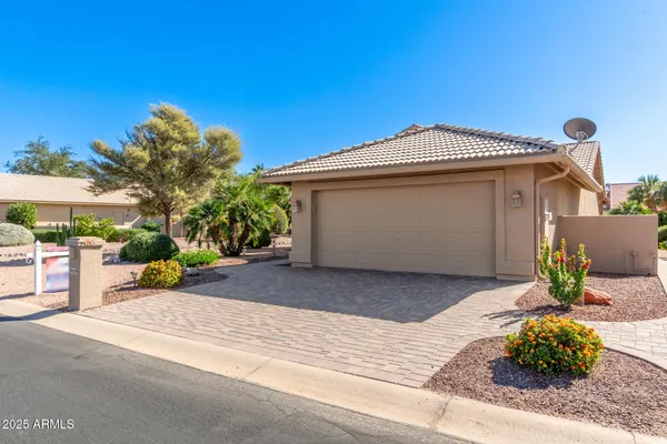 a front view of a house with a garage