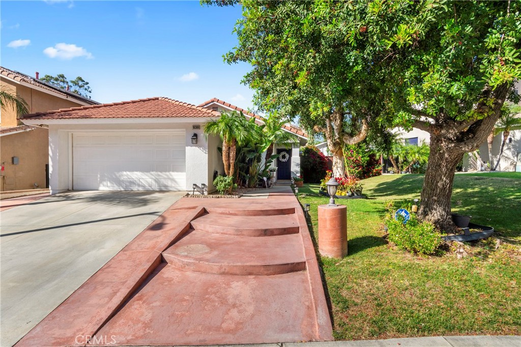 16366 West Sun Canyon Street Riverside, CA 92503 - Photo 21 of 21 a view of a house with a yard