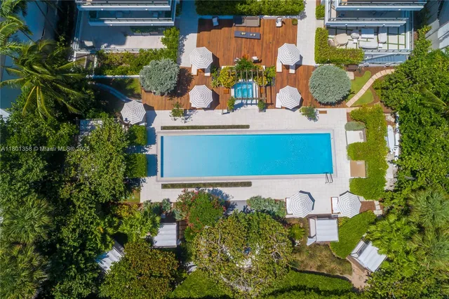 an aerial view of a houses with outdoor space