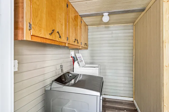 a bathroom with a sink and washing machine