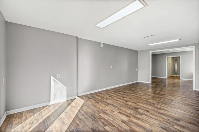 a view of a livingroom with wooden floor