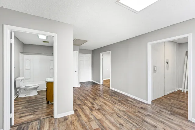 a view of a bathroom from a hallway