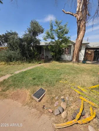 a view of a swimming pool with a yard